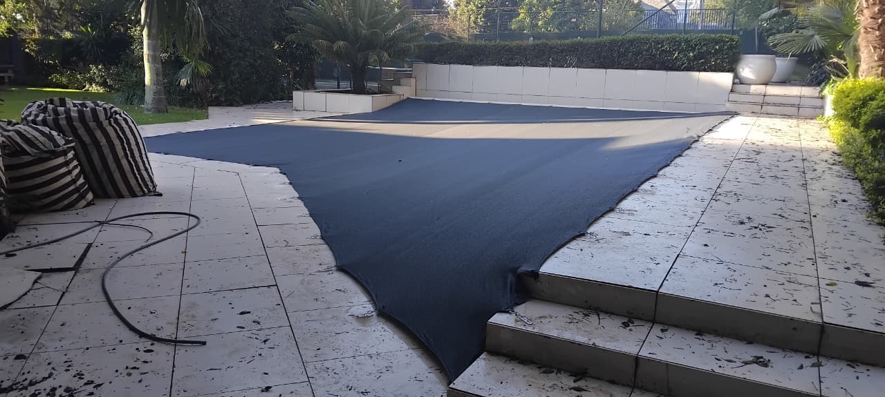 Professional pool cover installation with aluminum ratchet system